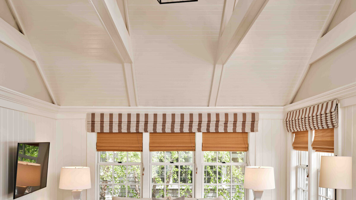 View of a living room with cathedral ceilings in one of the cottages at Harbor View Hotel on Martha's Vineyard.