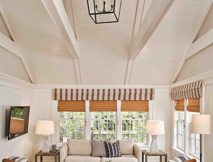 View of a living room with cathedral ceilings in one of the cottages at Harbor View Hotel on Martha's Vineyard.