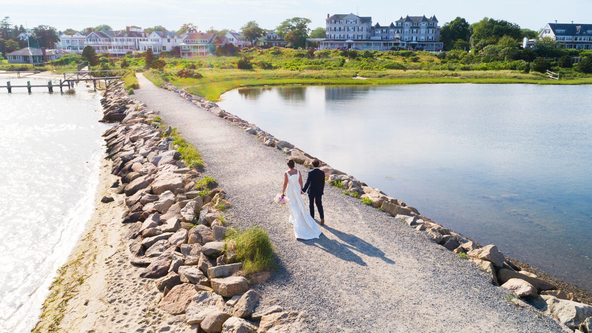 Aerial view of a bride and groom walking up the path in front of Harbor View Hotel on Martha's Vineyard.