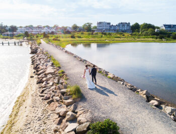 Aerial view of a bride and groom walking up the path in front of Harbor View Hotel on Martha's Vineyard.