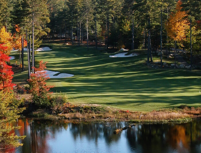 Looking over the water to the fairway of a golf hole at Lake Winnipesaukee Golf Club.