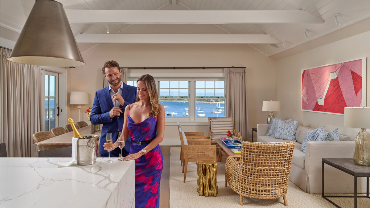 Harbor View Hotel Martha's Vineyard, couple enjoying champagne in the Skyhouse living room.