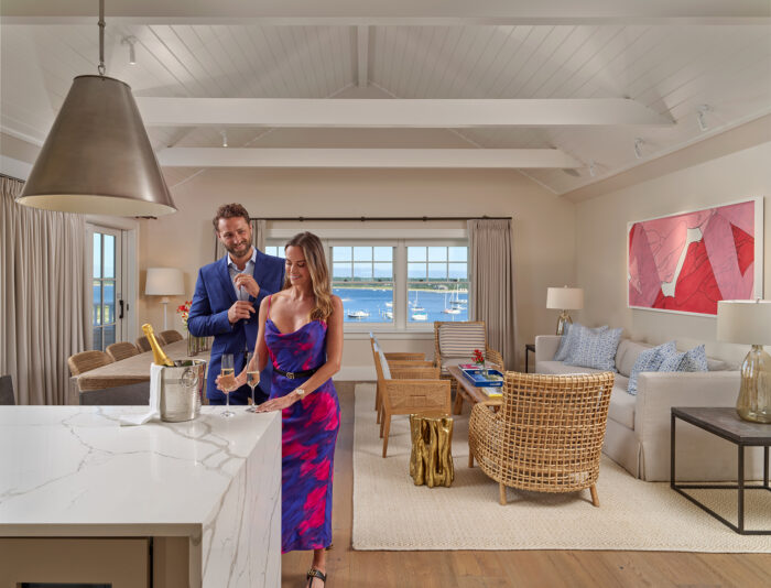 Harbor View Hotel Martha's Vineyard, couple enjoying champagne in the Skyhouse living room.